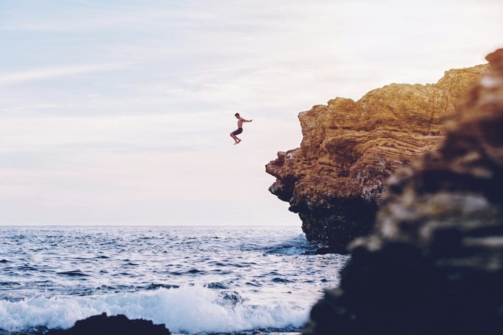 Cliff jump into ocean